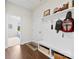 Welcoming mudroom with a bench, storage cubbies, and convenient access to the outdoors at 8840 Mullis Forest Ct, Mint Hill, NC 28227