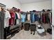 Walk-in closet featuring ample shelving and racks for optimal clothing storage at 8840 Mullis Forest Ct, Mint Hill, NC 28227