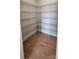Walk-in closet featuring wood floors and wire shelving for ample storage at 885 Regulus Ct # 42, York, SC 29745