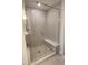 Modern shower featuring gray subway tile surround, glass enclosure, pebble floor, and convenient built-in bench at 885 Regulus Ct # 42, York, SC 29745