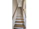 Modern staircase with wooden treads, white risers, and wooden handrails at 885 Regulus Ct # 42, York, SC 29745