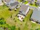 Aerial view of a home with a spacious backyard, a patio with seating, and manicured landscaping at 922 Bunker Trce, Rock Hill, SC 29730