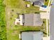 Aerial view of a home's backyard featuring a concrete patio, seating area, and mature trees at 922 Bunker Trce, Rock Hill, SC 29730