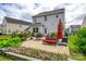 A beautifully landscaped backyard with a patio, seating area, and charming flower beds at 922 Bunker Trce, Rock Hill, SC 29730