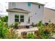 Lush backyard features a patio area surrounded by vibrant flowers and plants enhancing outdoor living at 922 Bunker Trce, Rock Hill, SC 29730