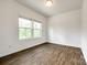 A room with wood floors and a double window at 922 Bunker Trce, Rock Hill, SC 29730