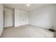 Cozy bedroom with plush carpeting, neutral walls, and ample closet space for storage at 922 Bunker Trce, Rock Hill, SC 29730