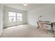 Bright bedroom featuring large windows and a modern desk with a comfortable chair at 922 Bunker Trce, Rock Hill, SC 29730