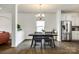 Modern dining room with a sleek table, stylish chandelier, and stainless steel refrigerator at 922 Bunker Trce, Rock Hill, SC 29730