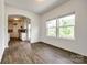 Dining room view with natural light, hardwood floors, and archway to the kitchen at 922 Bunker Trce, Rock Hill, SC 29730