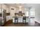 Bright kitchen featuring white cabinets, a center island with seating, and stainless steel appliances at 922 Bunker Trce, Rock Hill, SC 29730
