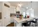 Bright kitchen features white cabinets, an island, and a pantry at 922 Bunker Trce, Rock Hill, SC 29730