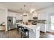 Modern kitchen with white cabinets, stainless steel appliances, and a large island at 922 Bunker Trce, Rock Hill, SC 29730