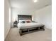 Main bedroom featuring decorative headboard, natural light, and neutral color scheme at 922 Bunker Trce, Rock Hill, SC 29730