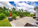 Spacious backyard patio featuring a red umbrella and ample space for outdoor entertaining at 922 Bunker Trce, Rock Hill, SC 29730