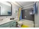 Bathroom featuring a vanity with a shell shaped soap dispenser and sea themed decor at 9239 N Vicksburg Park Ct, Charlotte, NC 28210
