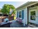 Inviting front porch with quaint seating, brick detail, and a welcoming entrance at 9239 N Vicksburg Park Ct, Charlotte, NC 28210