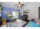 Comfortable living room with a ceiling fan and sliding glass doors leading to the backyard at 9239 N Vicksburg Park Ct, Charlotte, NC 28210