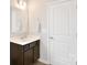 Bathroom featuring vanity with a sleek countertop, contemporary fixtures, and ample cabinet space at 104 Rockridge Point Dr, Mooresville, NC 28117
