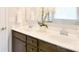 Bathroom vanity featuring dual sinks, stylish faucet, and decorative floral arrangement at 104 Rockridge Point Dr, Mooresville, NC 28117