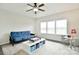 Bright bonus room featuring a futon, natural light from the windows, and room for entertainment at 104 Rockridge Point Dr, Mooresville, NC 28117