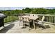 Inviting wooden deck with stylish outdoor dining set, perfect for relaxing and entertaining at 104 Rockridge Point Dr, Mooresville, NC 28117