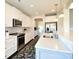 Stylish kitchen with white cabinets, marble countertops, stainless appliances, and a decorative floral rug at 104 Rockridge Point Dr, Mooresville, NC 28117