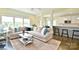Spacious living room showcases an open layout with hardwood floors, comfortable seating, and kitchen view at 104 Rockridge Point Dr, Mooresville, NC 28117