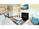 Comfortable living room with a fireplace, TV, plush seating, and hardwood floors at 104 Rockridge Point Dr, Mooresville, NC 28117