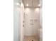 Modern shower with dual shower heads, tiled walls, and built-in shower shelves at 104 Rockridge Point Dr, Mooresville, NC 28117