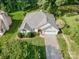 Aerial view of a well-maintained single-story home with a driveway, lush greenery, and manicured lawns at 105 Banksridge Rd, Fort Mill, SC 29715