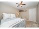 Cozy bedroom featuring neutral walls, ceiling fan, window, and a closet at 105 Banksridge Rd, Fort Mill, SC 29715