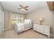 Comfortable bedroom with window, ceiling fan, and plenty of natural light at 105 Banksridge Rd, Fort Mill, SC 29715