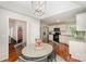 Bright breakfast nook with an adjacent kitchen and round table and four chairs at 105 Banksridge Rd, Fort Mill, SC 29715