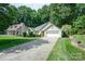 Charming single-story home with well-manicured lawn and attached two-car garage at 105 Banksridge Rd, Fort Mill, SC 29715