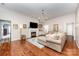 Bright living room with hardwood floors, fireplace, and stylish chandelier at 105 Banksridge Rd, Fort Mill, SC 29715