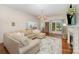 Cozy living room with a sectional sofa, fireplace, and natural light at 105 Banksridge Rd, Fort Mill, SC 29715
