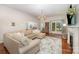 Cozy living room with a sectional sofa, fireplace, and natural light at 105 Banksridge Rd, Fort Mill, SC 29715