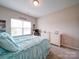 Bedroom featuring a white bed, dresser, and a window letting in plenty of natural light at 114 Sierra Chase Dr, Statesville, NC 28677