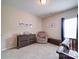 Bedroom featuring a dresser, glider, and dark brown storage chest, creating a comfortable and organized space at 114 Sierra Chase Dr, Statesville, NC 28677