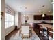 Bright dining area with hardwood floors, kitchen view, and natural light from a window at 114 Sierra Chase Dr, Statesville, NC 28677