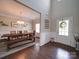 Open dining room area featuring a large wooden table and view to the foyer at 114 Sierra Chase Dr, Statesville, NC 28677