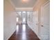 Long hallway with hardwood floors leading to the foyer at 114 Sierra Chase Dr, Statesville, NC 28677