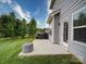 Outdoor patio with a grill, wood storage, and a cozy seating area, perfect for entertaining at 114 Sierra Chase Dr, Statesville, NC 28677