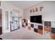 Fun playroom with 'PLAY' decor, toy kitchen, organized storage, and a large TV at 114 Sierra Chase Dr, Statesville, NC 28677