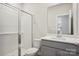 Clean bathroom featuring a glass-enclosed shower, updated fixtures, and modern vanity at 116 Obadiah Ct, Mooresville, NC 28115
