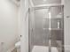 Modern bathroom showcasing a glass-enclosed shower, tile walls, and updated fixtures at 116 Obadiah Ct, Mooresville, NC 28115