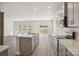 Modern kitchen features stainless steel appliances, an island, and granite countertops at 116 Obadiah Ct, Mooresville, NC 28115