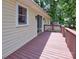 Side view of a home and back deck with a sliding door at 11850 Sugar Hill Rd, Davidson, NC 28036