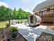 Backyard patio featuring a barrel sauna, grill, lawn, and home with a deck at 11850 Sugar Hill Rd, Davidson, NC 28036